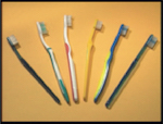 Different shapes of toothbrushes.